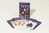 The Bundle: Nordic Love PuzzleTwist, Mug and Deck of Cards features Cindy Lindgren's Scandinavian-themed illustrations on the card deck, celebrating heritage with unique designs on the box and cards.