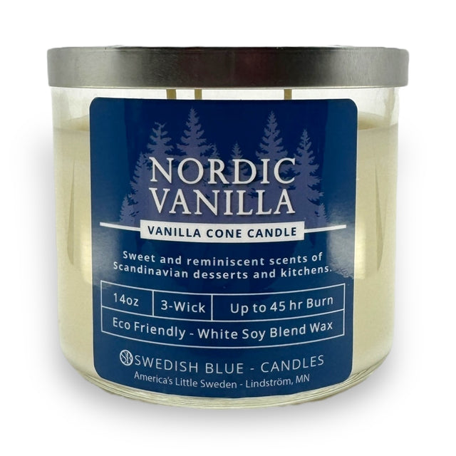 The Candle: Nordic Vanilla – Vanilla Conde Candle is a 14oz, 3-wick vanilla-scented candle in a glass jar with a blue label detailing its scent, burn time, eco-friendly wax, and brand—ideal for cozy spaces.