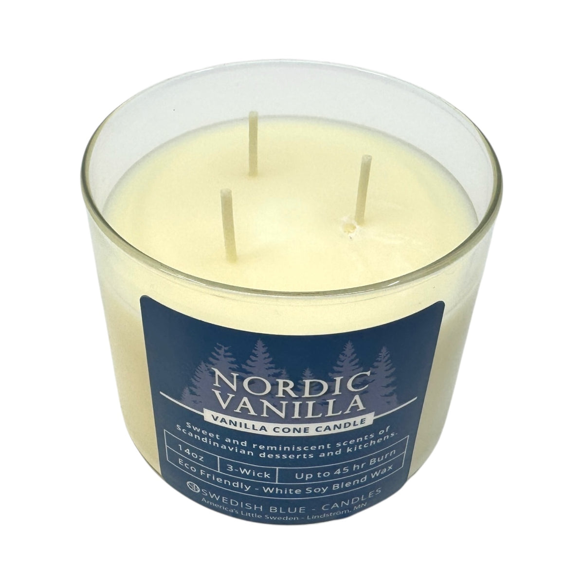 The Candle: Nordic Vanilla – Vanilla Conde Candle is a 14 oz, three-wick soy blend candle in a glass jar with a blue label, offering a cozy Nordic winter vanilla scent—ideal for fans of comforting vanilla aromas.