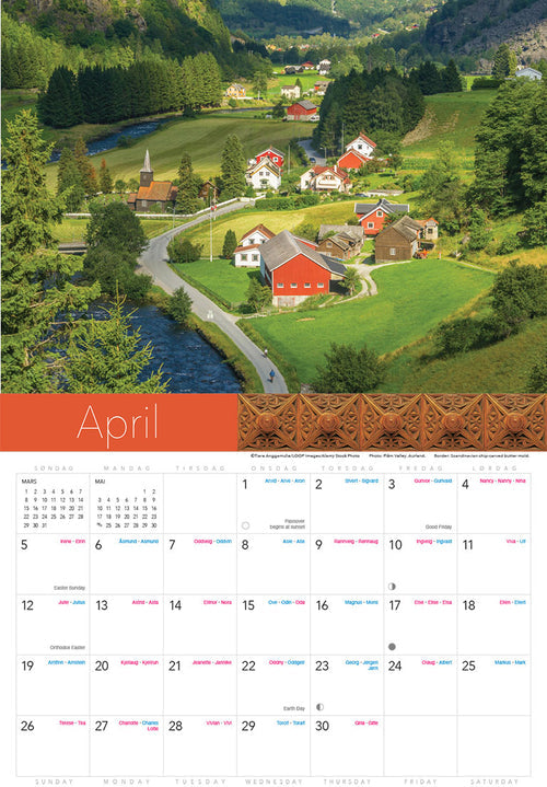 The Splendor of Norway Calendar 2026 features a scenic rural Norwegian village with red and white houses, a church, winding road, and river among green hills; Aprils image is shown below.