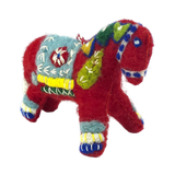 Red felt Swedish Dala horse ornament with blue, yellow, green, and white embroidered patterns on the body, legs, and head.