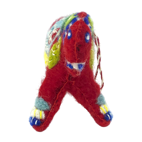 Felted wool Scandinavian animal ornament with four legs, decorated with red, blue, green, and yellow accents on a white background.