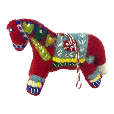 Red felted wool Swedish Dala horse ornament with colorful embroidered patterns and a blue saddle patch, shown on a plain white background.