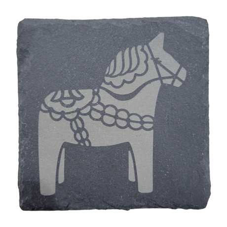 Slate coaster showcasing a laser-engraved Swedish Dala Horse with ornate patterns, capturing every detail beautifully.