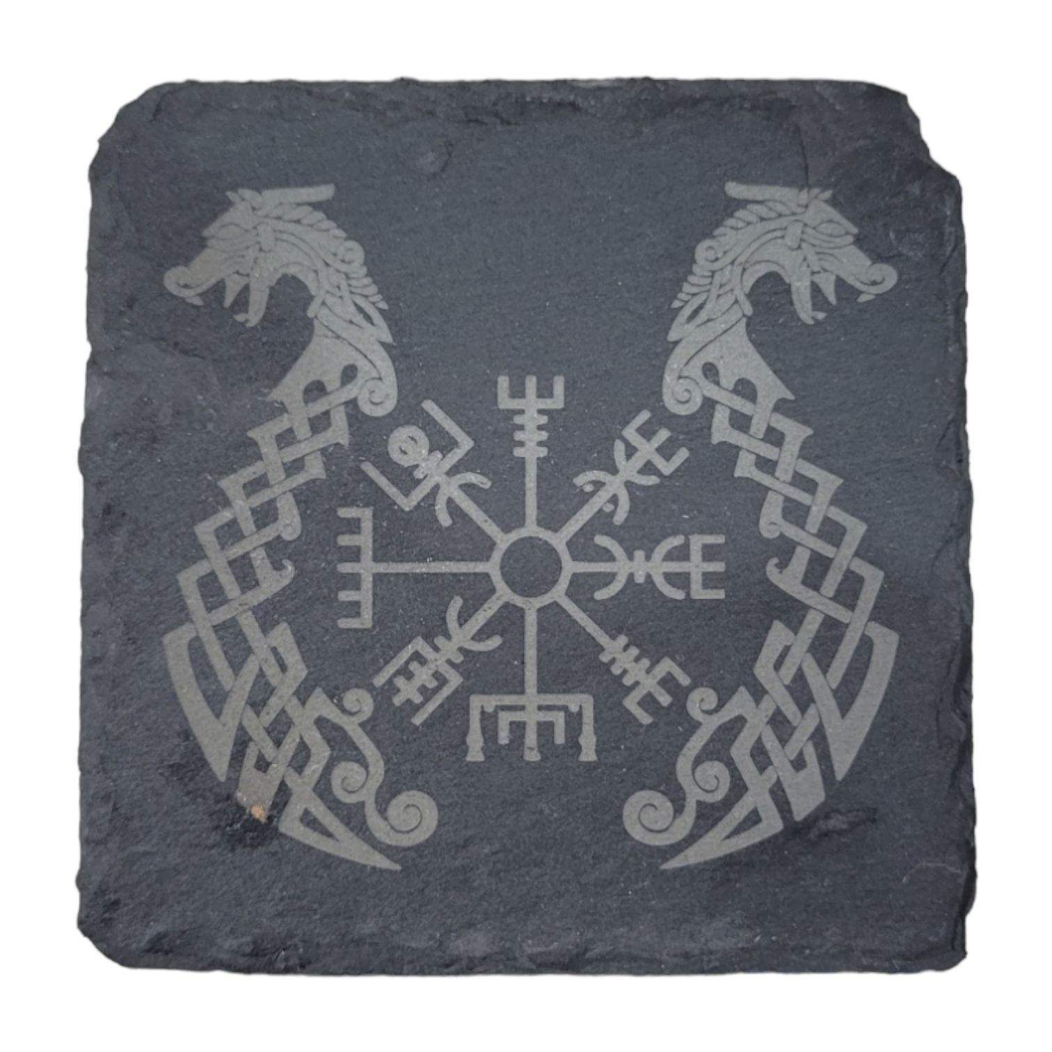 The laser-engraved Viking Slate Coaster displays intricate Viking imagery, featuring a compass-like design at the center and two stylized animal heads facing outward.