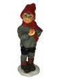 A delightful Norwegian-inspired "Apple Boy Large" figurine, showcasing a child in a red hat and scarf holding an apple, elegantly positioned on a white base.