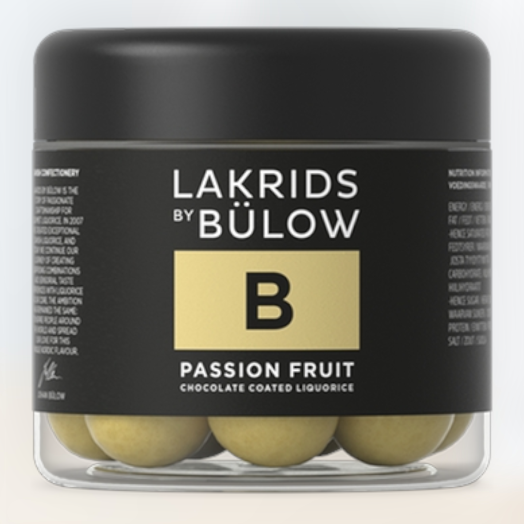 A 125g jar of Lakrids by Bülow #B Passion Fruit Danish chocolate coated licorice—round yellow candies in a black-labeled jar, offering a unique confectionery treat.