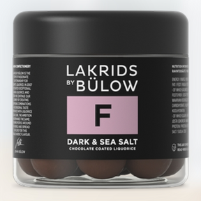 A jar of Lakrids by Bülow, named "Candy: Lakrids by Bülow - #F Dark & Sea Salt (125g)," offers the F flavor, featuring dark chocolate-coated licorice with sea salt flakes.