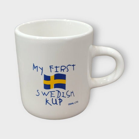 This 3oz white ceramic mug, titled "My First Swedish Kup," is adorned with blue text and a Swedish flag, making it an ideal mug for children.
