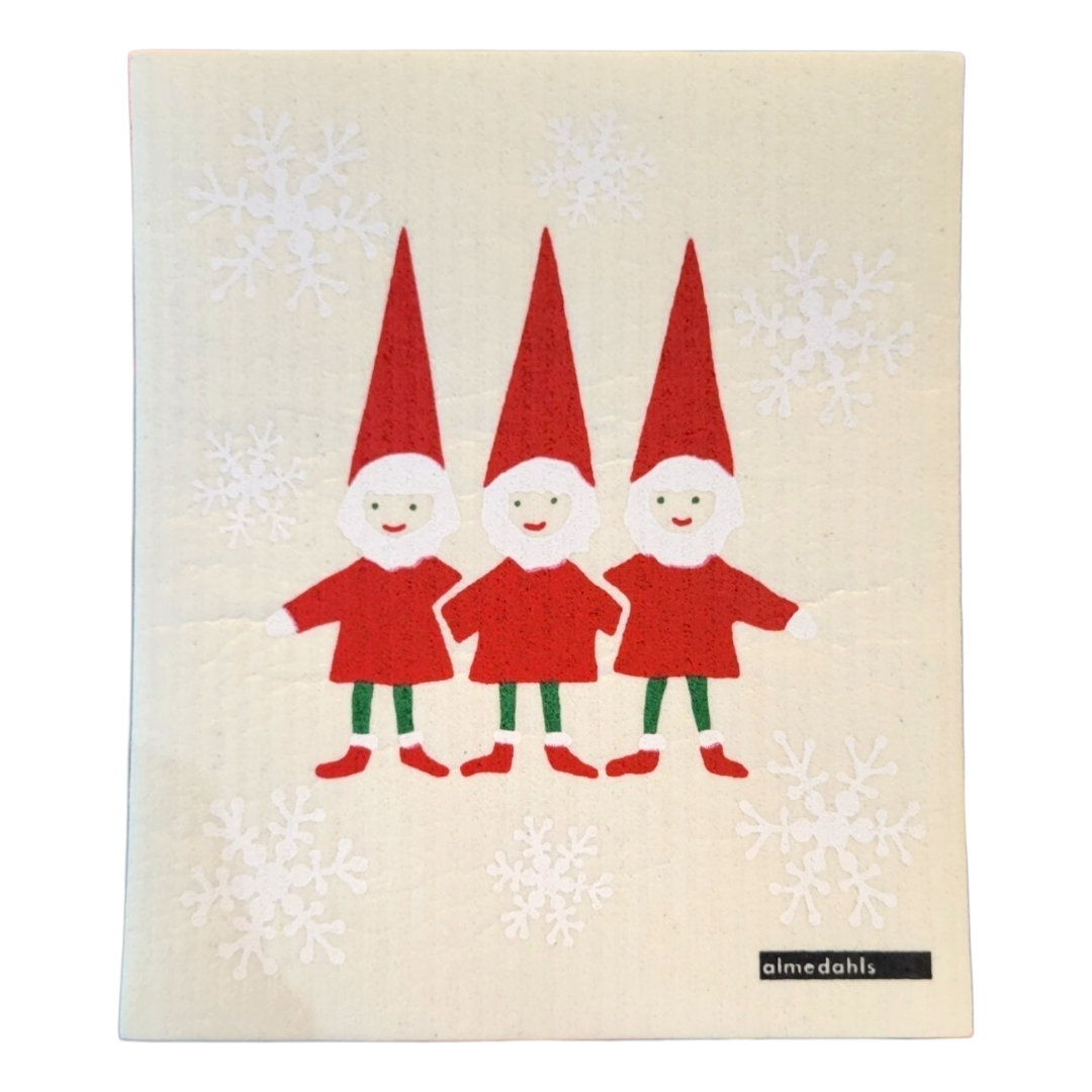 Three gnomes in red outfits and hats stand together on a beige background with white snowflakes, reminiscent of the Dish Cloth: Tomtenisse.