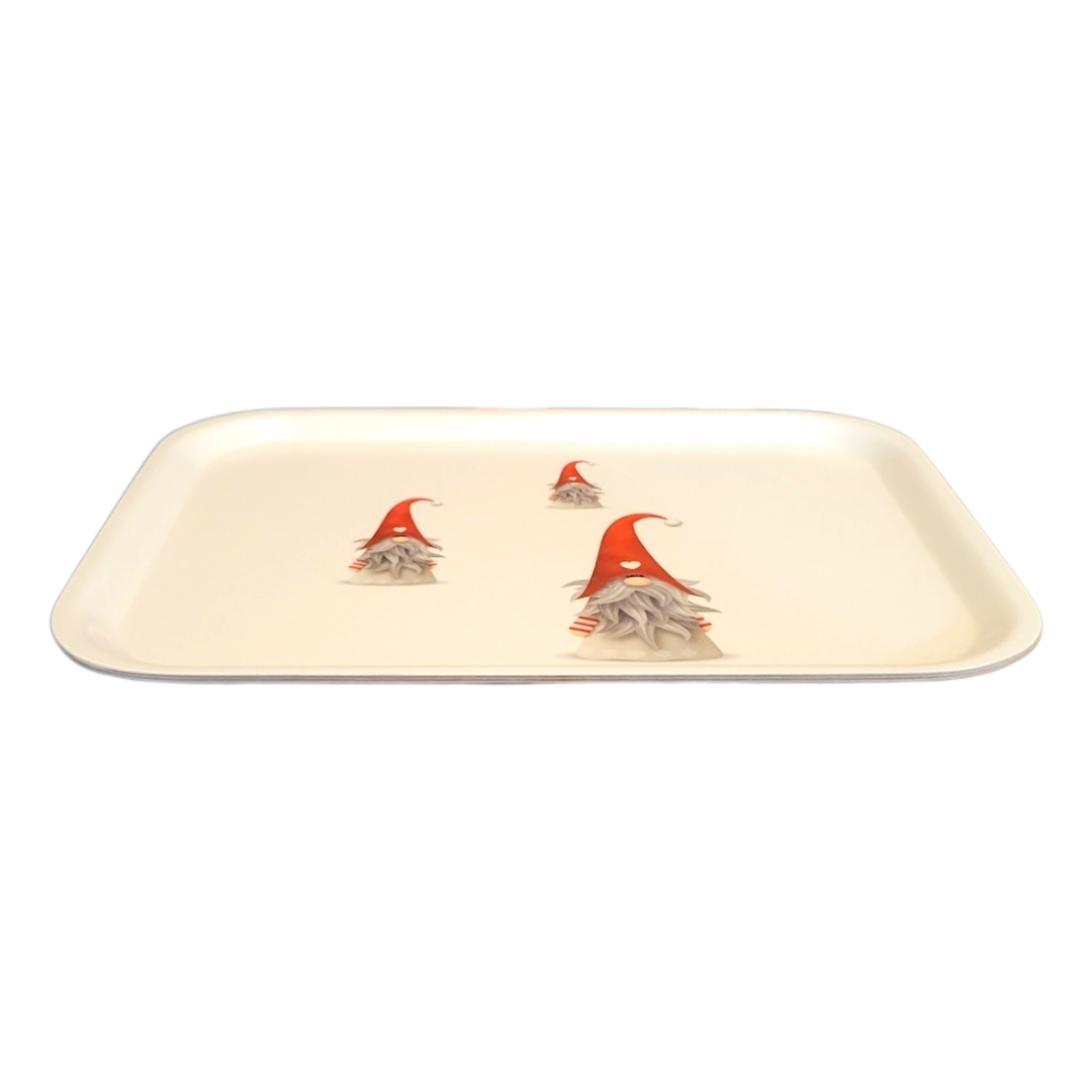 The Tray: 3 Tomten on a Birch Laminated Tray features charming tomten with red hats on a white background. Made in Sweden, it adds whimsical elegance to your décor.