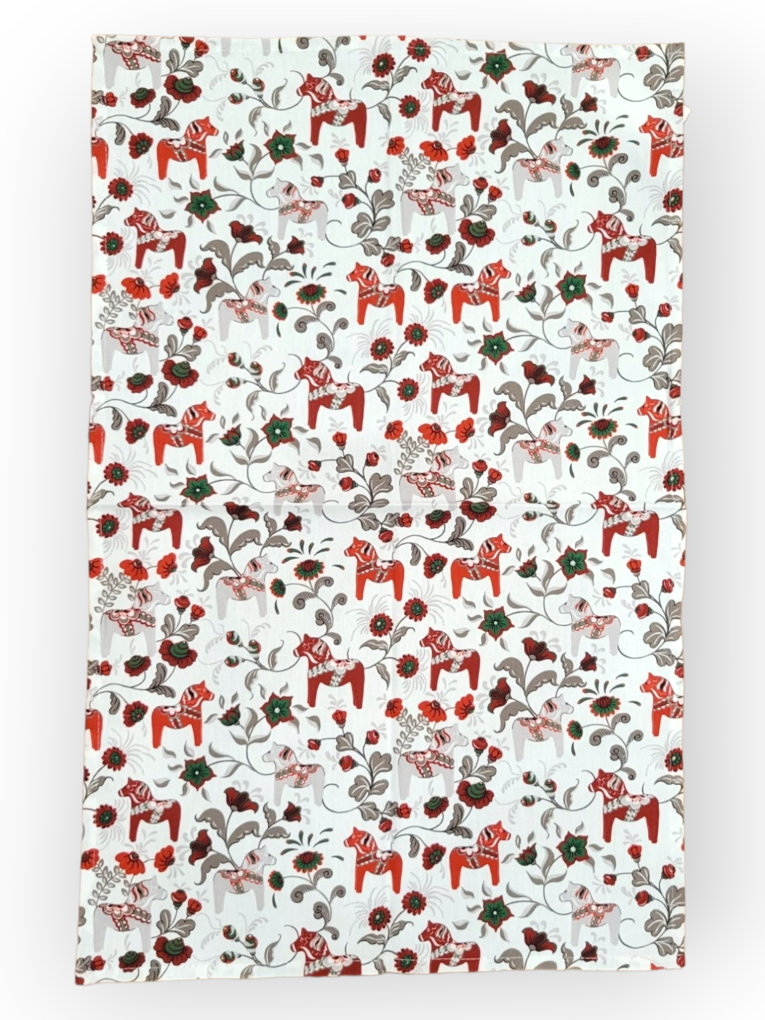 The Tea Towel: Leksand Mini White/Red Dala Horse features an energetic design with red and orange Dala horses prancing alongside brown and green Swedish flowers, adorned with swirling vines on a fresh white background, all made from 100% cotton.