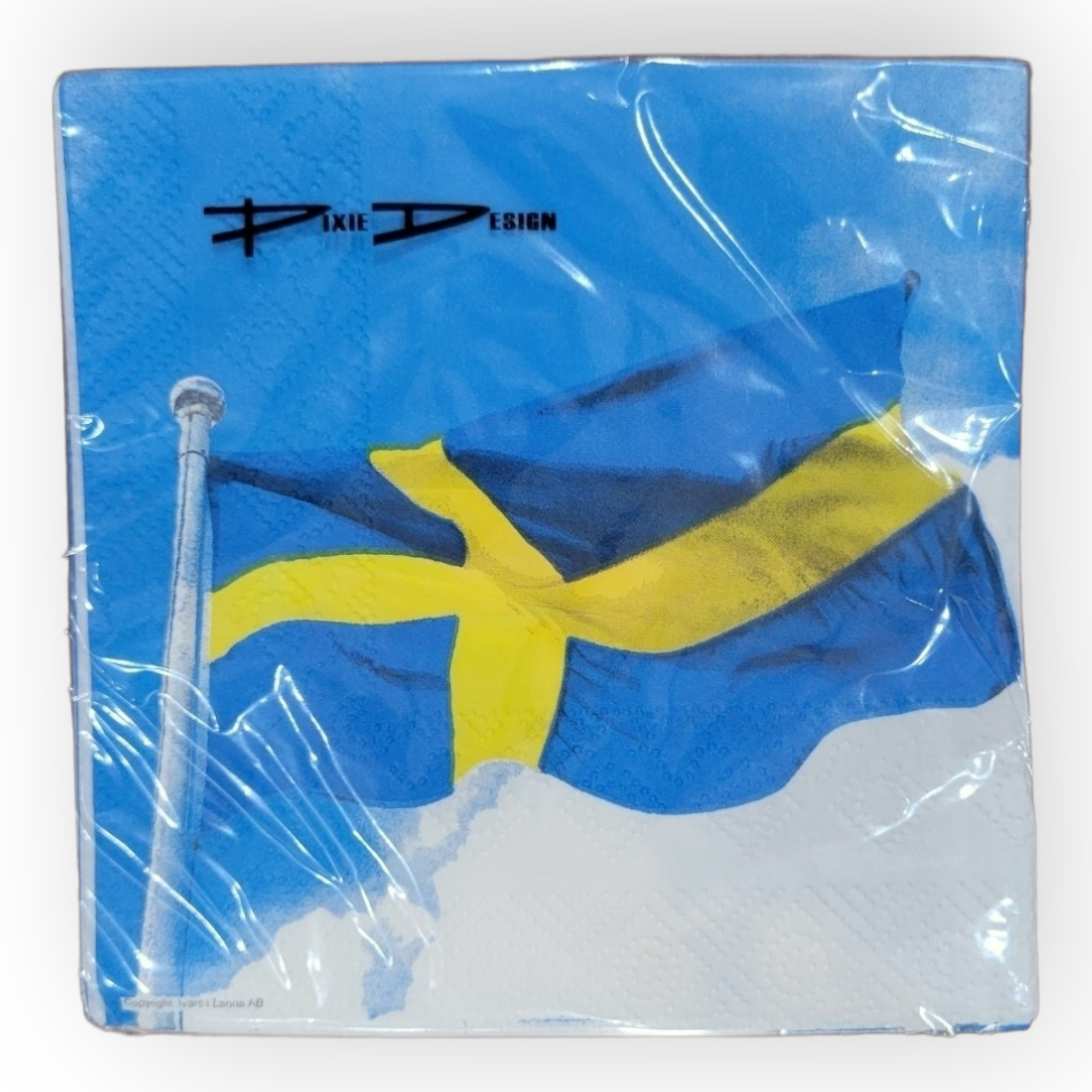 A 5" x 5" folded napkin from the Flaggstang/Swedish Flag collection, showcasing a Swedish flag design with the Pixie Design logo set against a blue sky background.