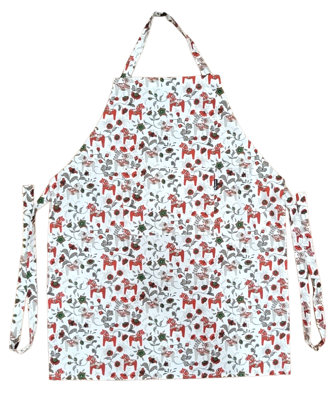 The Leksand Mini Swedish Dala Horse Apron showcases a charming pattern of red horses and green leaves on white, capturing the essence of Arvidssons Textile design. Available in 4 color options.