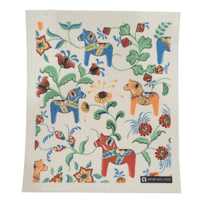 Leksands Mini Cream Dish Cloths featuring blue, red, and orange Dala horses on a white background are crafted from biodegradable cotton, providing vibrant design alongside eco-friendly functionality.
