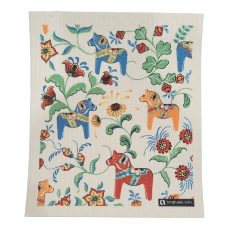 Leksands Mini Cream Dish Cloths featuring blue, red, and orange Dala horses on a white background are crafted from biodegradable cotton, providing vibrant design alongside eco-friendly functionality.