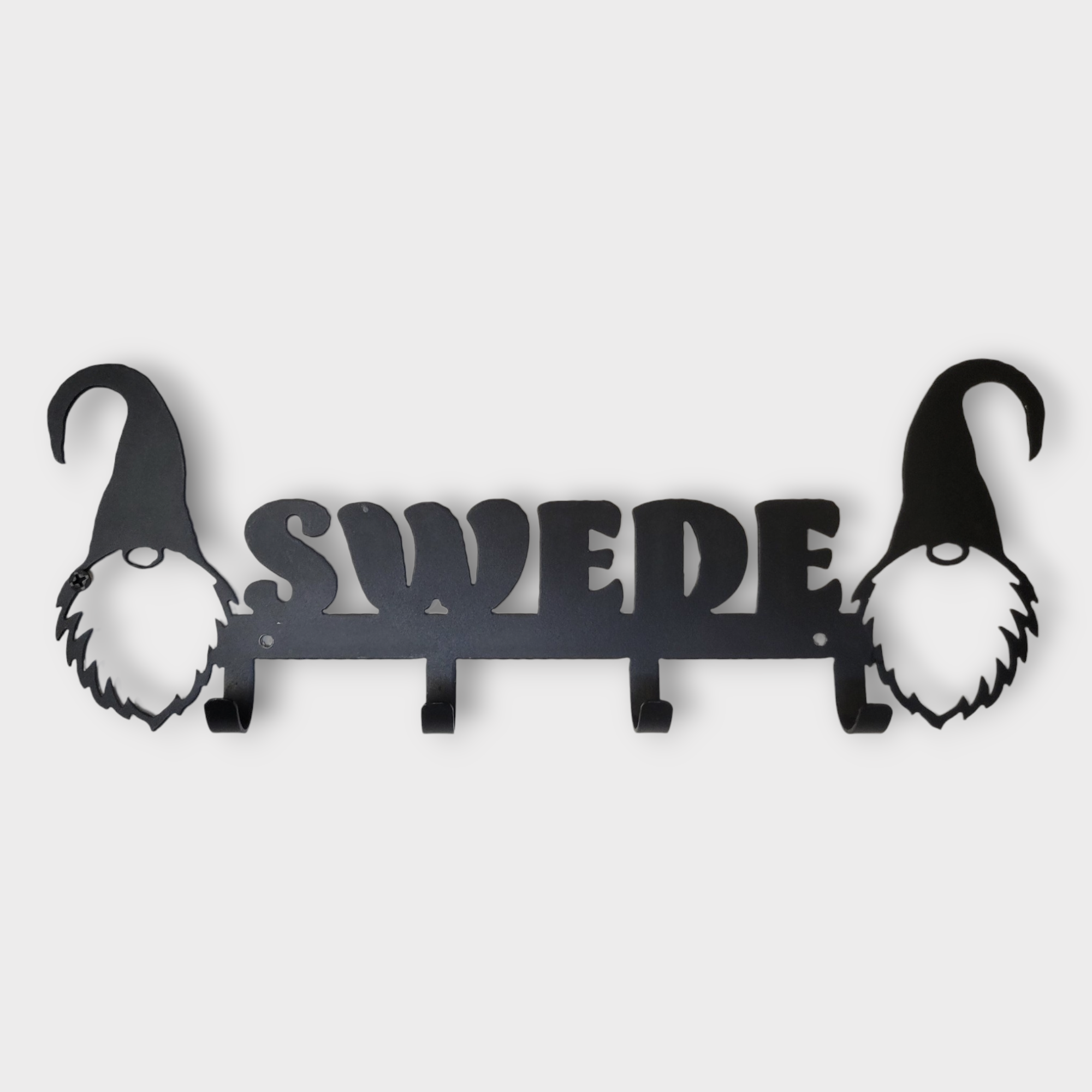 The "Coat Hooks: Gnome Swede Gnome" features a metal design with the word SWEDE and gnome silhouettes on both sides, offering four sturdy hooks for hanging items.