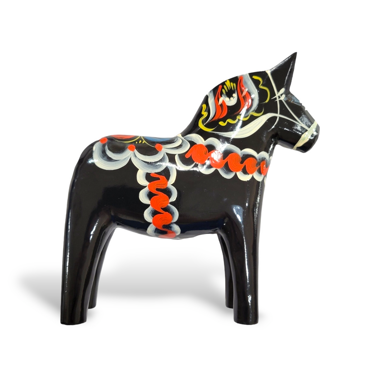 The Dala Horse: Black is a hand-carved wooden figurine that evokes traditional Swedish craftsmanship, showcasing vibrant painted designs set against its black surface.