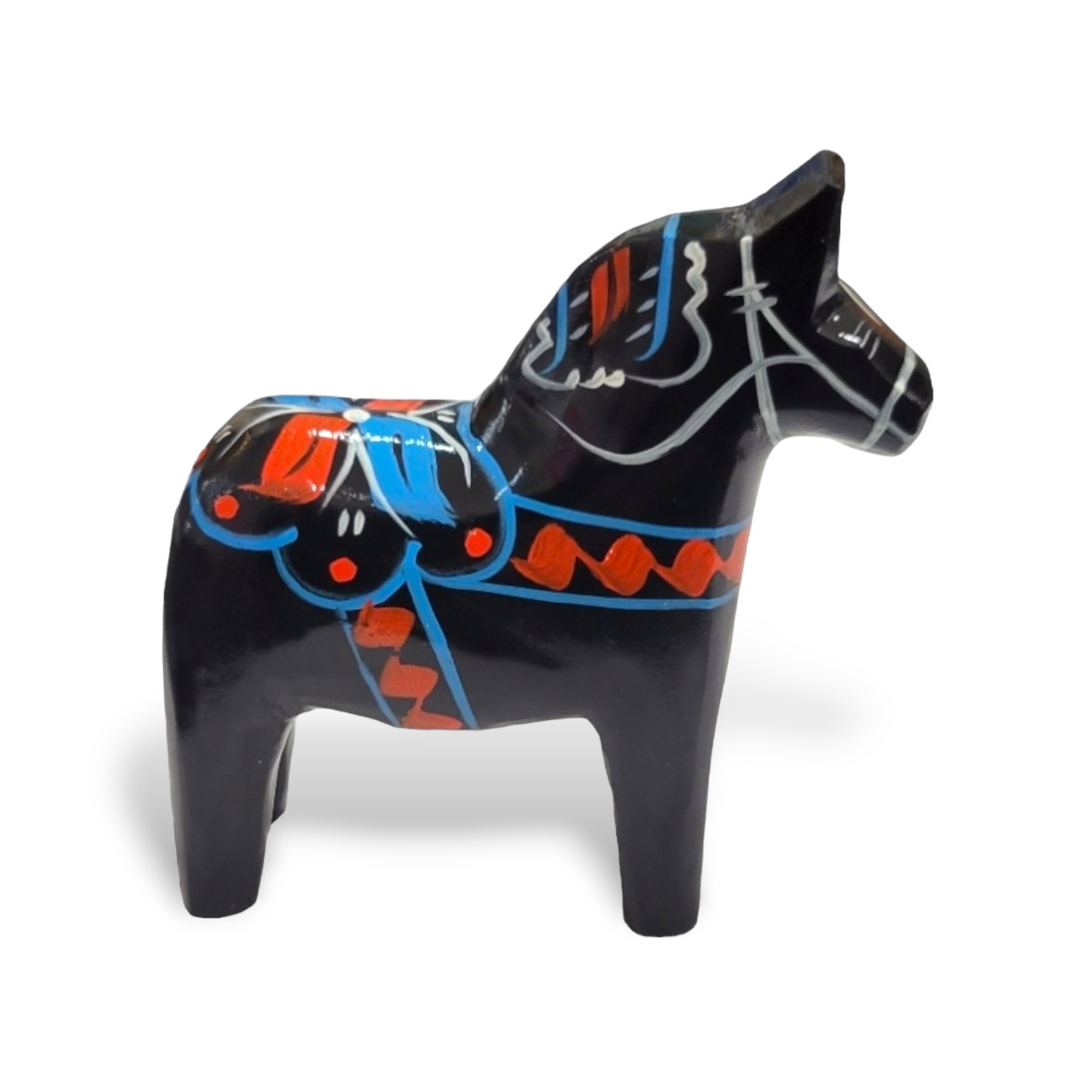 The Dala Horse: Black is a hand-carved wooden figurine that pays homage to Swedish traditional craftsmanship, featuring vibrant patterns in red, blue, and white on a sleek black background.