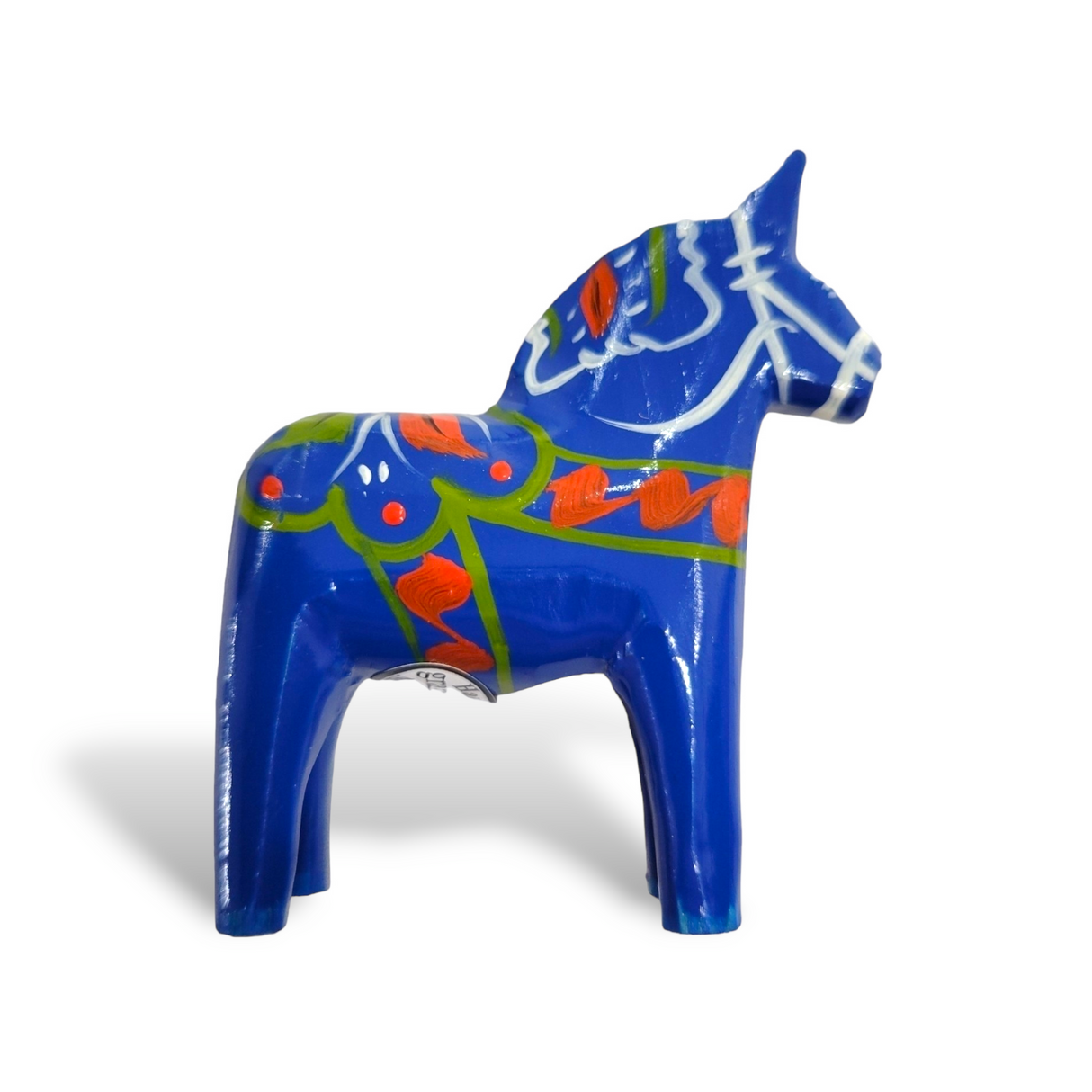 A hand-carved, Swedish Dala horse in royal blue with multi-color trim.