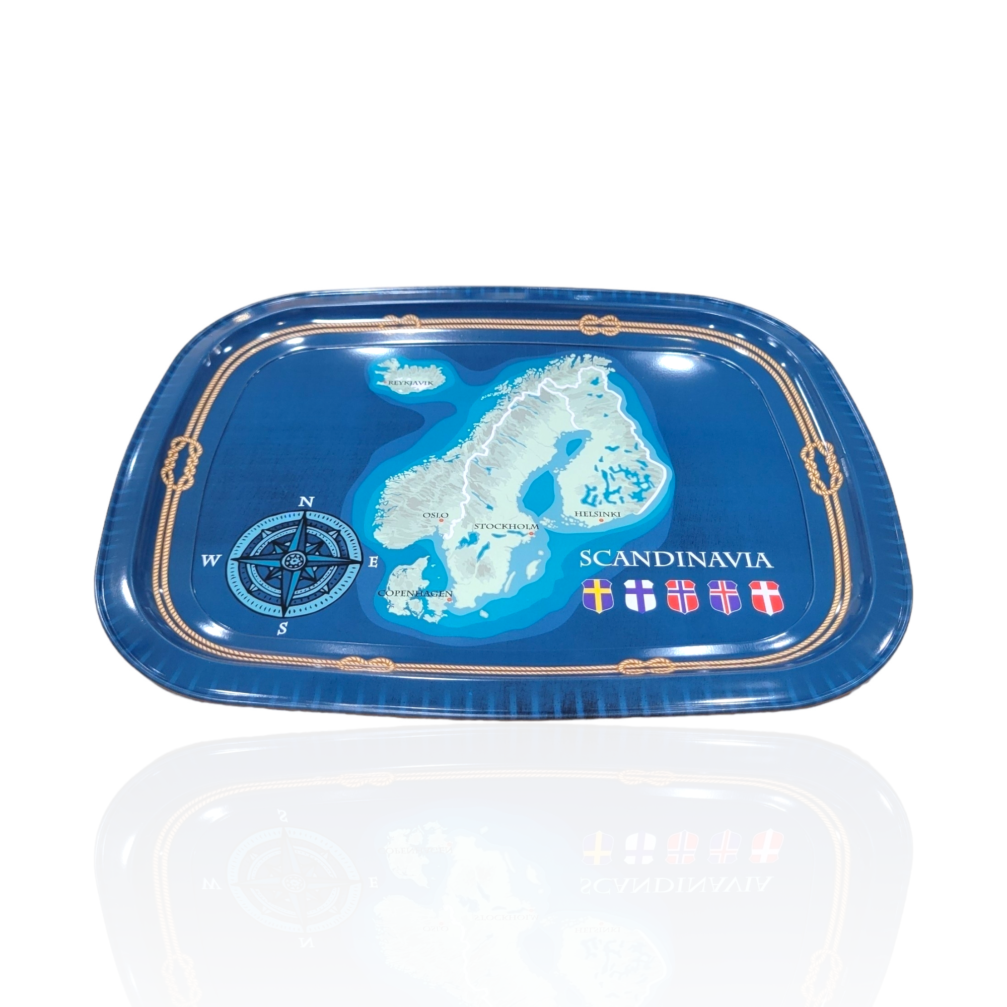 Introducing the Tray: Scandinavia 10x12, a blue rectangular tray measuring 10 by 12 inches, featuring an intricate map of Scandinavia embellished with flags and a compass. This tin tray beautifully blends functionality with Nordic charm, making it an ideal addition to any setting.