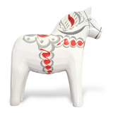 White Swedish Dala horse figure with multi-color trim, crafted from Sweden pine wood.