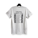 Introducing the "Viking World Tour" Tee: This gray T-shirt proudly displays a list of years and countries, including England, Wales, and France, on the back. Crafted from 100% Gildan Heavy Cotton for superior comfort and durability.