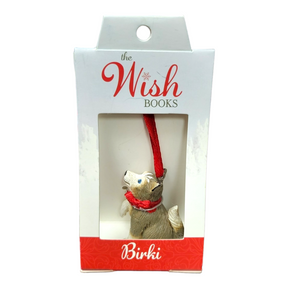 An ornament named Birki - Anja's Husky Puppy from The Wish Books, featuring a dog with a red ribbon nestled in a box, perfect for adding a touch of Christmas magic, as if crafted by Santa's Elves themselves.