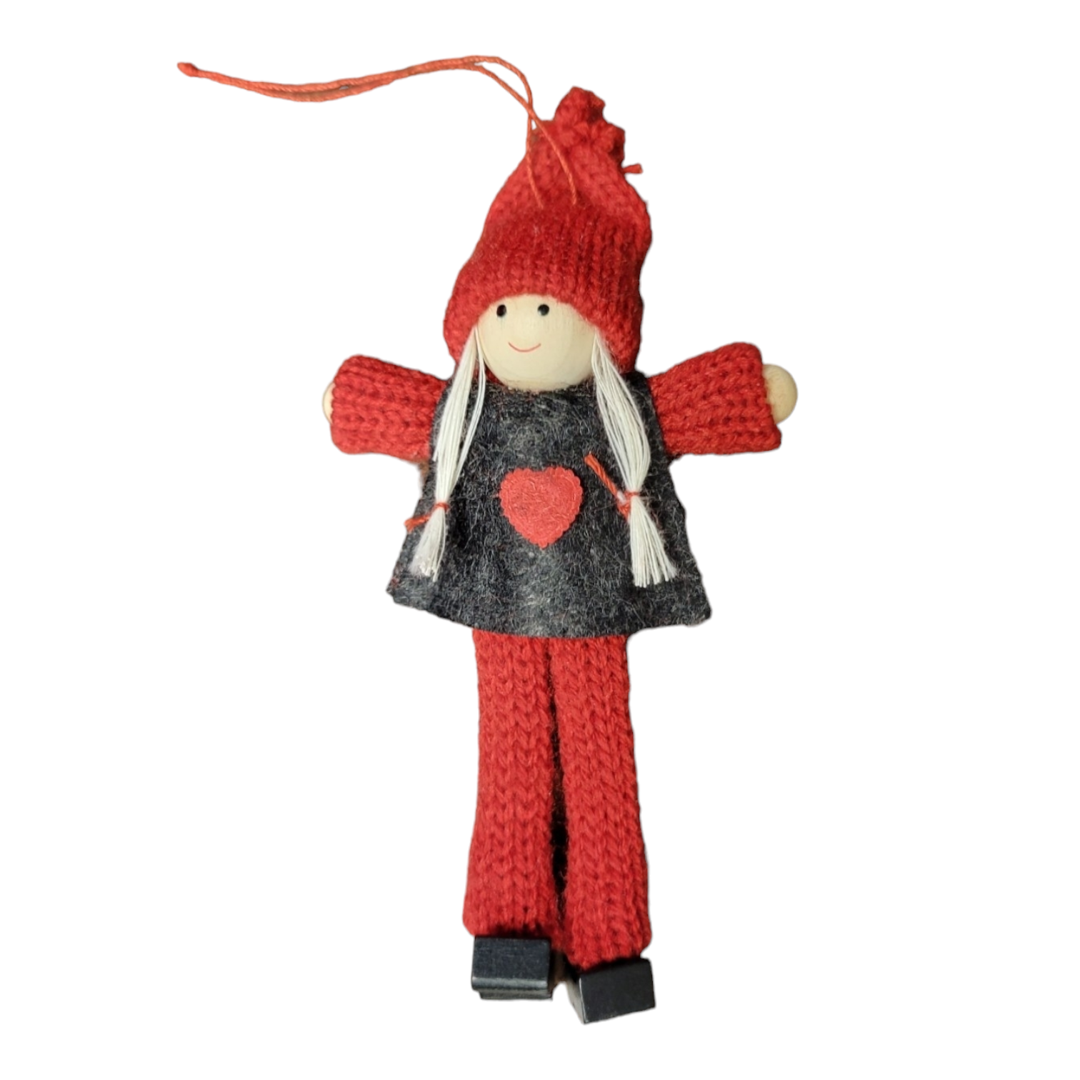 This handcrafted Christmas tree ornament showcases a doll in a girl's red knit outfit featuring a black vest adorned with a red heart, along with wood head, hands, and boots. The doll's long white hair and hanging string add an enchanting touch to your decor.