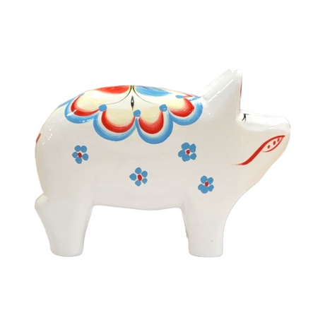 The Dala Pig: White is a ceramic figurine featuring vibrant floral designs in blue, red, and yellow, inspired by traditional Swedish craftsmanship.