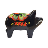 The Dala Pig: Black is a ceramic figurine inspired by traditional Swedish craftsmanship, featuring colorful painted floral patterns on its side.