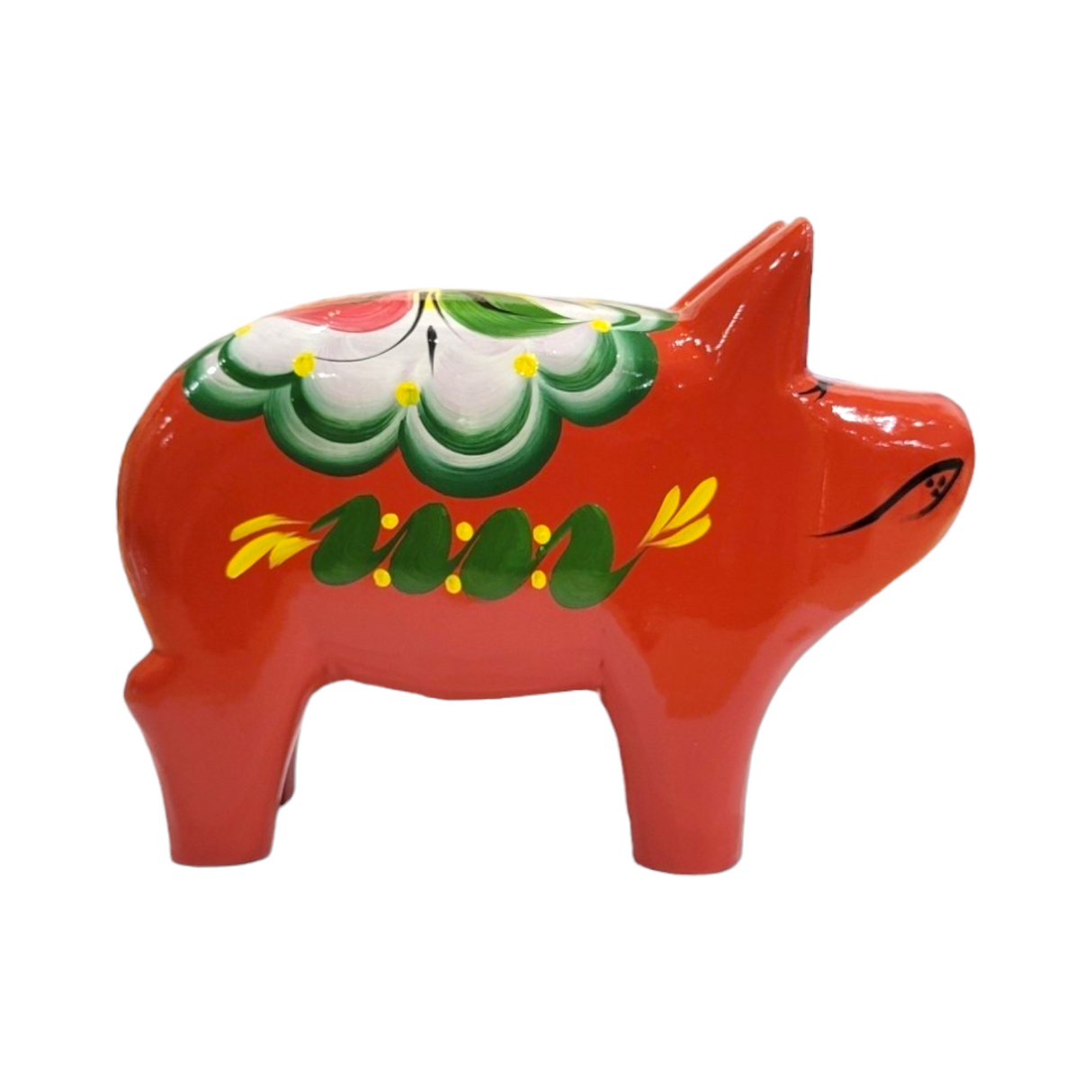 The Dala Pig: Red is a ceramic pig featuring green and white decorative patterns on its back, capturing the essence of traditional Swedish craftsmanship.