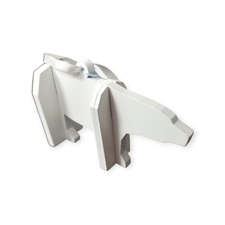 White cardboard cutout tree ornament featuring Tiny the Polar Bear from the Polar Bear Wish Book, with silver edges and a ribbon on top.