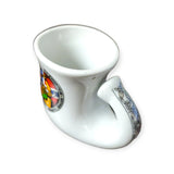 A Viking horn shot glass featuring two vibrant coat of arms designs and a subtle hint of the Norwegian flag on its surface.