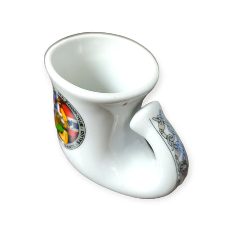 A Viking horn shot glass featuring two vibrant coat of arms designs and a subtle hint of the Norwegian flag on its surface.