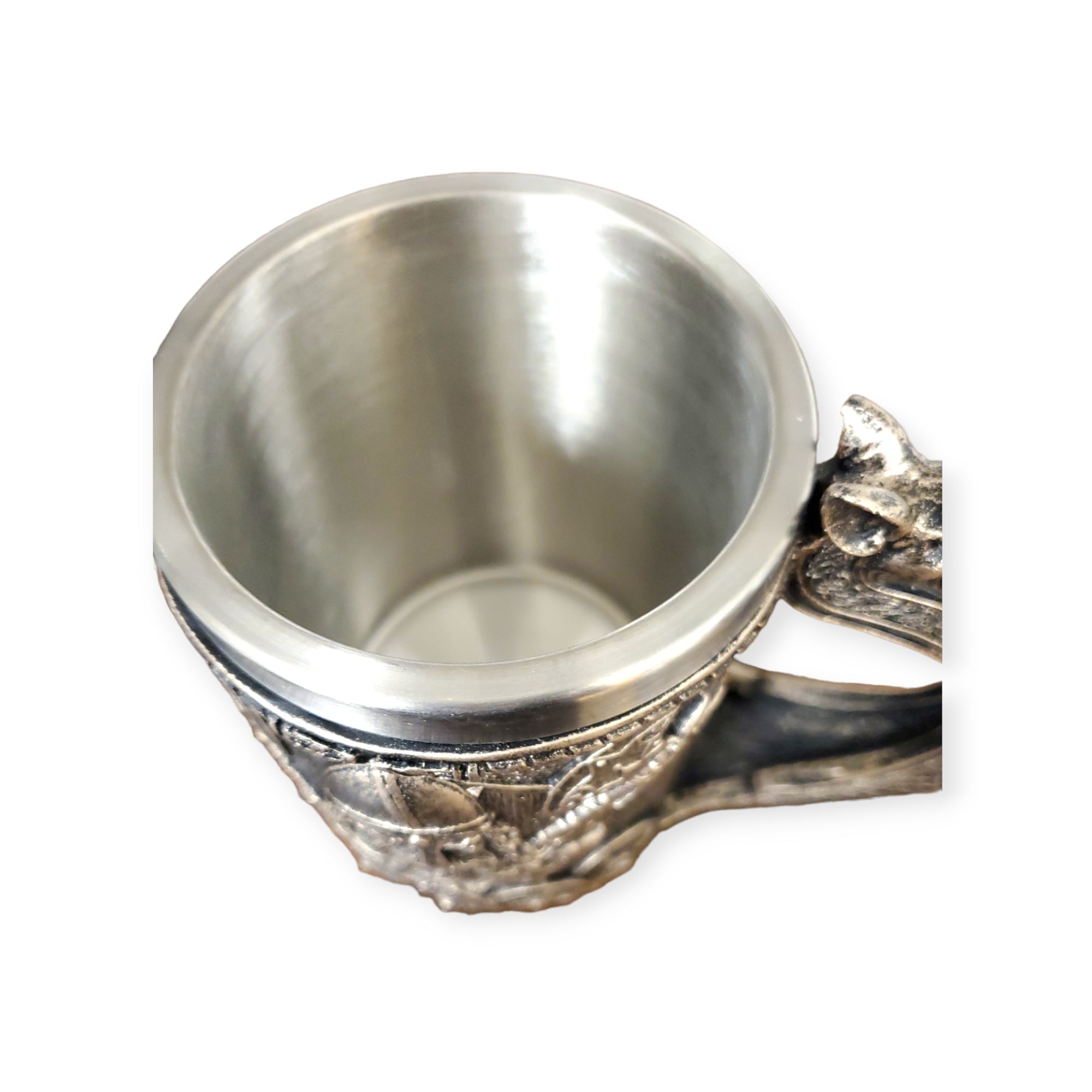 18oz mug named Viking Ship, featuring a silver metal finish with an ornate handle and engraved design, seen from above.