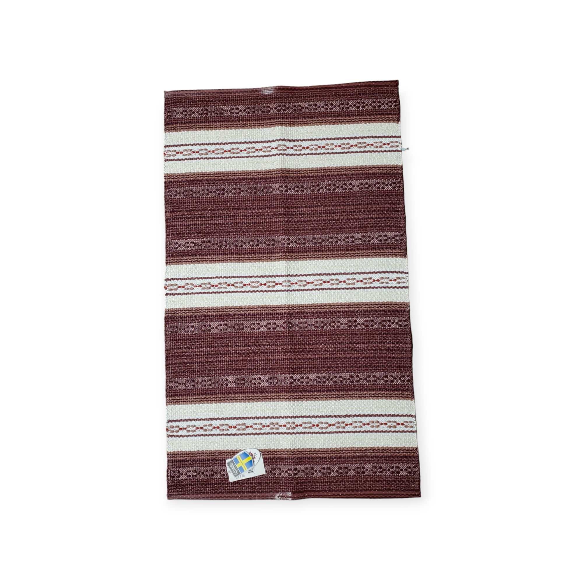 Horredsmattan - Astor - Red is a Swedish vinyl rug with red and white stripes, featuring a small label in one corner and crafted from environmentally friendly PVC.