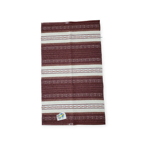 Horredsmattan - Astor - Red is a Swedish vinyl rug with red and white stripes, featuring a small label in one corner and crafted from environmentally friendly PVC.