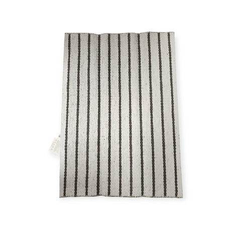 A vertically striped dark gray vinyl textile rug, Horredsmattan Music, features a woven design.