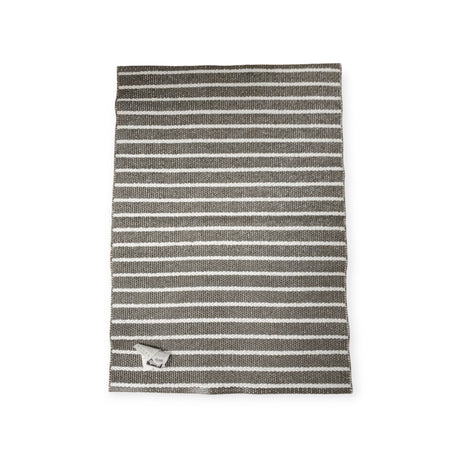 A tea towel with gray and white stripes, reminiscent of the detailed patterns in the Vinyl Rug: Horredsmattan - Music - Dark Gray, features a small tag in the bottom corner and is laid flat against a white background.