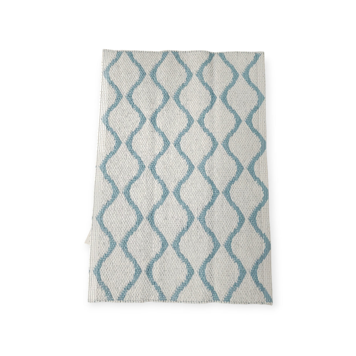 The Rug: Wave Blue is a white kitchen towel that boasts a blue wavy line pattern, ensuring both durability and longevity.