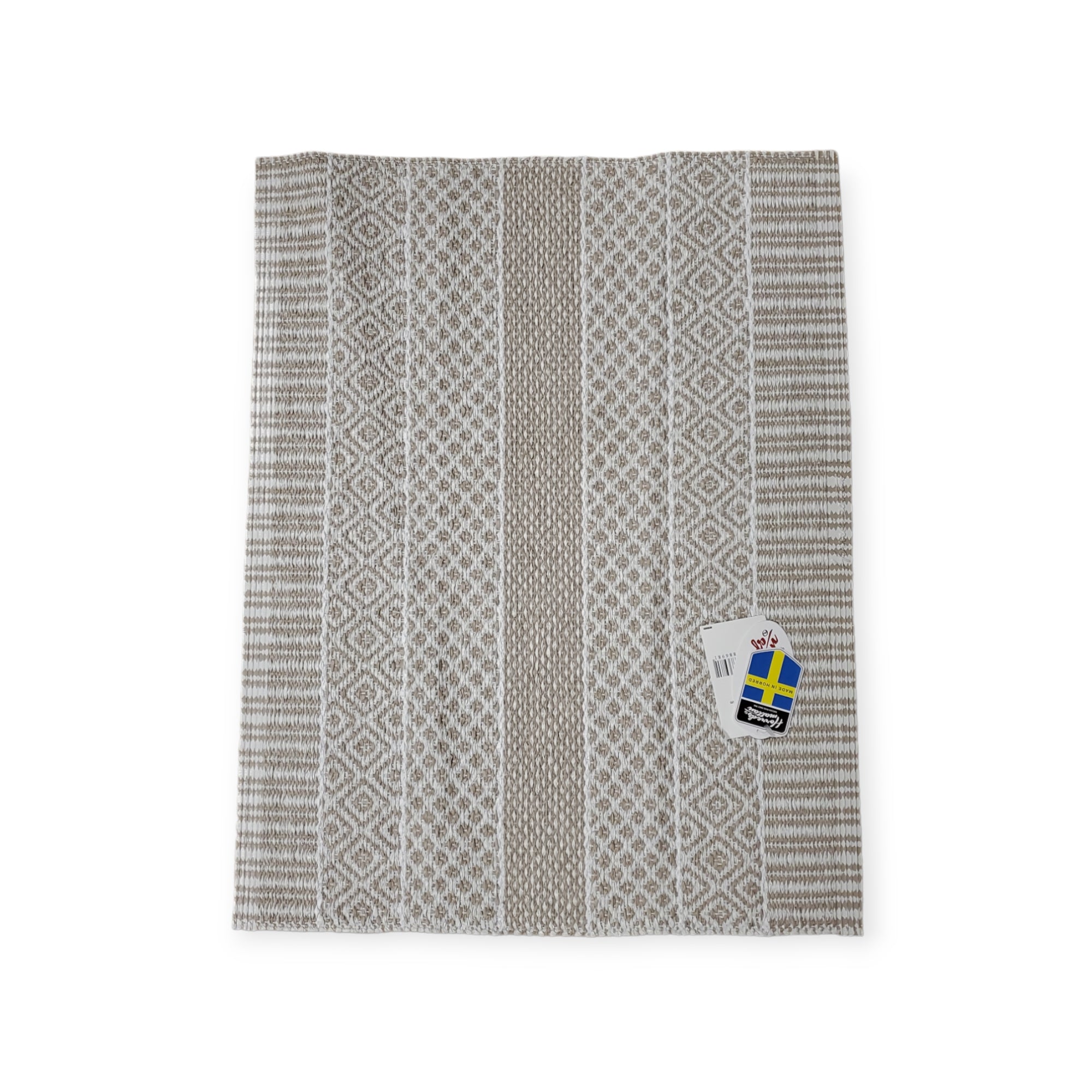 A kitchen towel with attached tags, bearing white and grey geometric designs inspired by a Swedish vinyl rug similar to the Vinyl Rug: Horredsmattan - Alfie - Sand, includes a small Swedish flag.