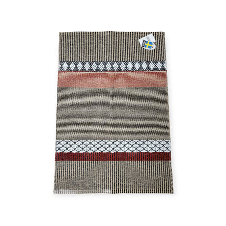 A rectangular Swedish vinyl rug, Horredsmattan Savanne in beige, with horizontal patterns and a small tag showing a blue and yellow flag in the top right corner.
