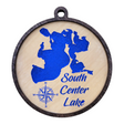 The Ornament: South Center Lake - Round Etched Wood is a wooden circular ornament, measuring 3 1/2 inches, that showcases a blue silhouette map with the label "South Center Lake" and includes a compass rose.