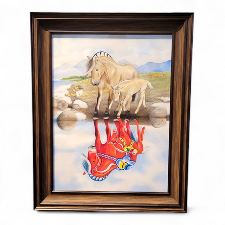This 23x29 framed artwork, titled "Norwegian Fjord Reflection," features a Norwegian Fjord horse and foal near a water source. Their reflections depict two stylized red horses, beautifully capturing the essence of Rachael Koppendrayer's original creation.