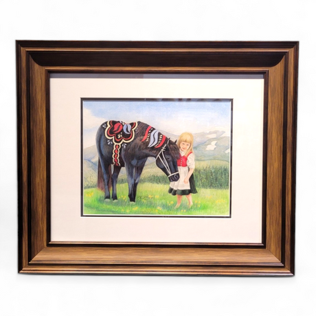 Framed artwork titled "Don't Be Shy," measuring 25x21, featuring a young girl in traditional attire alongside a decorative black horse reminiscent of Dala ponies in a field with mountains in the background.