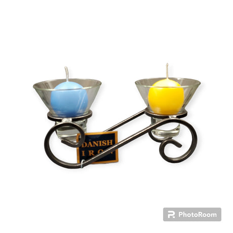 The Danish Iron Candle Holder, complete with two Leif glass cups for ball candles, exemplifies Scandinavian craftsmanship and modern elegance with its vibrant blue and yellow votive displays.