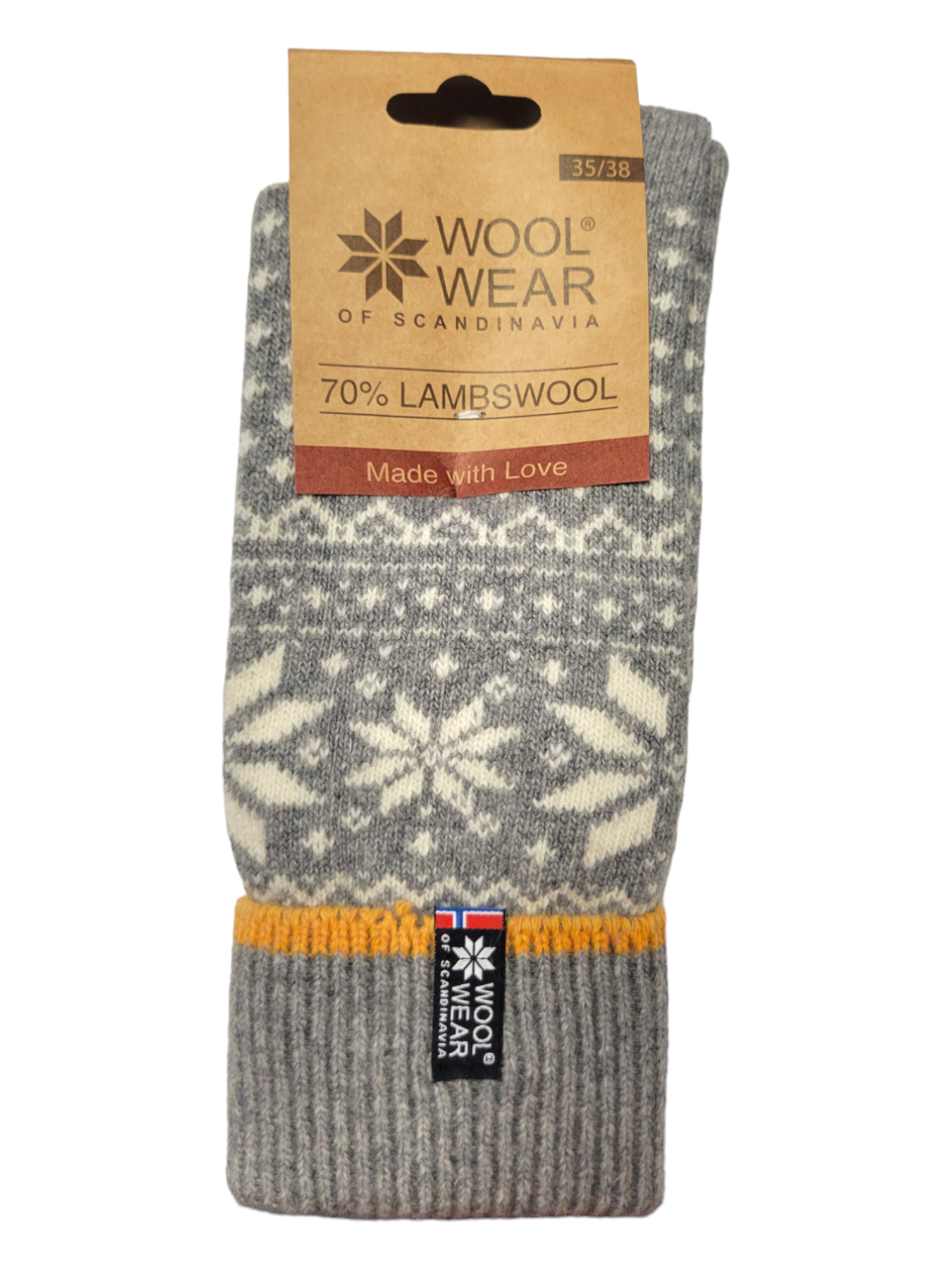 Socks from Wool Wear, featuring a blend of 70% lambswool in gray with white snowflake patterns accented by gold elements and the Norwegian flag, are finished with a brown tag detailing the product specifics.