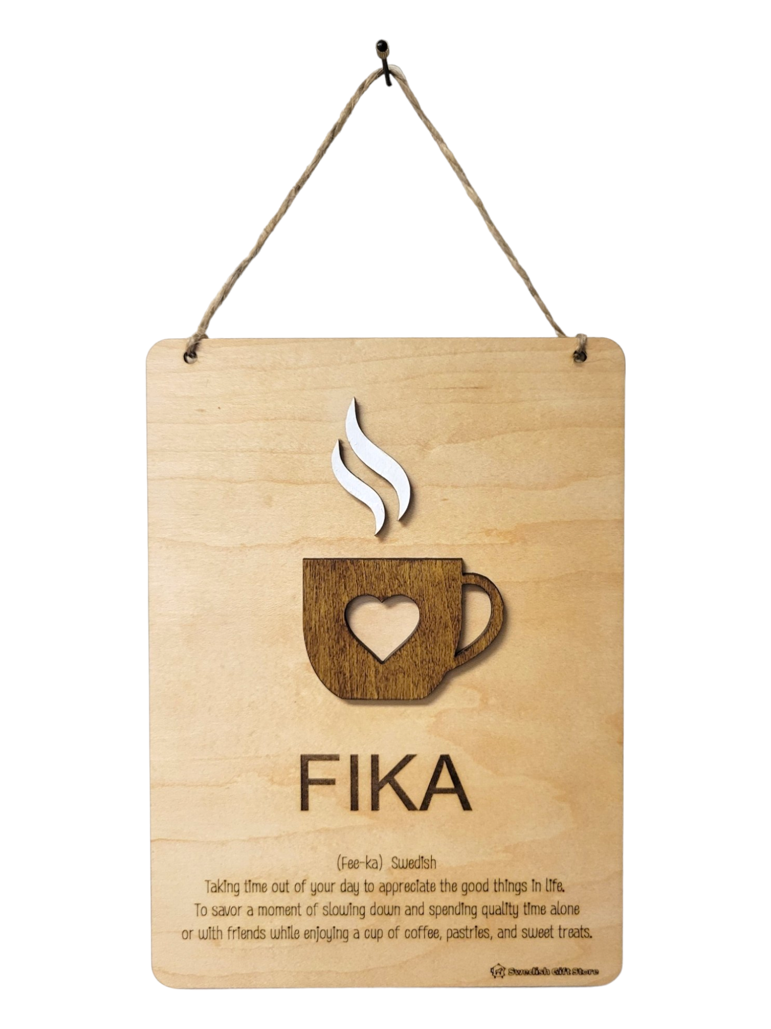 Sign: Fika Definition with laser-cut steaming coffee design, inspiring you to pause and enjoy life's simple delights such as coffee, pastries, and sweet treats.