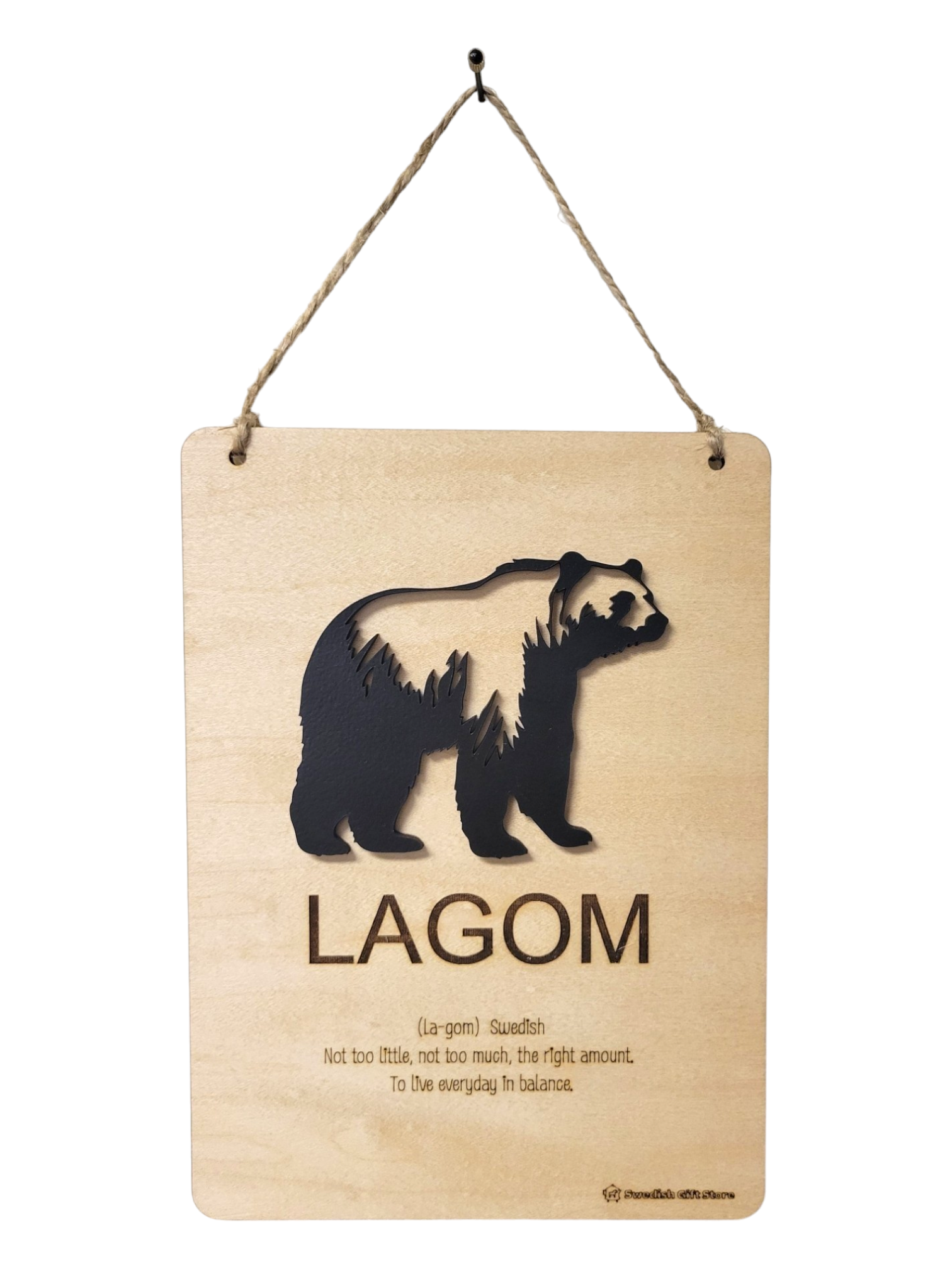 Sign: Lagom Definition - This wooden sign features a black bear silhouette and the word "LAGOM" etched into the wood. Below, it provides the definition of Lagom, explaining it as a Swedish term meaning not too little, not too much—the perfect balance to live in harmony.